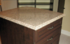 Island with drawers and hamper combo on front and back, custom granite top. Chocolate Pear color - Premier Finish.